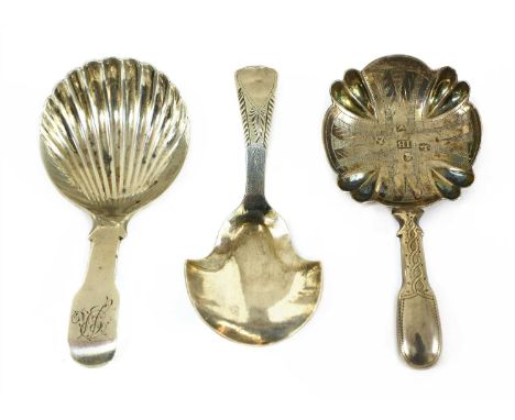 A George IV silver caddy spoon, by GF, Exeter 1825, with scalloped bowl, monogrammed, together with a second , John Bettridge
