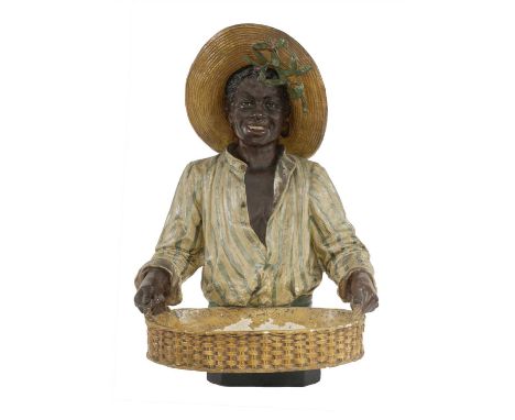 A terracotta and painted bust-length blackamoor figure, early 20th century, in the manner of Goldscheider, the man in a straw