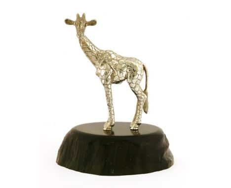 A contemporary silver sculpture of a giraffe, by Patrick Mavros, Zimbabwe, the naturalistically carved ebony base, inset with