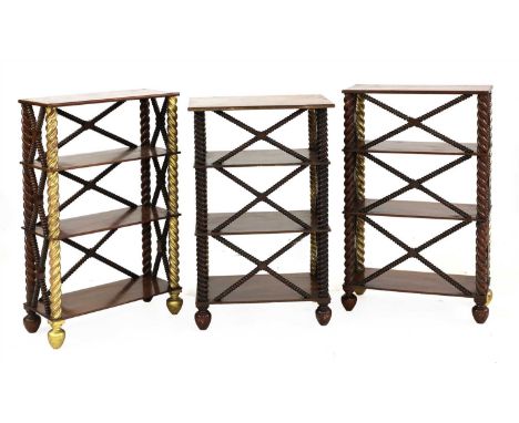 A pair of mahogany étagères, with gilt front supports, latticed bobbin turned cross stretchers, with four shelves, 49.5cm wid