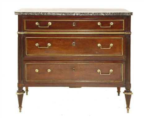 A French mahogany commode chest, 19th century, the shaped rectangular marble top above three long drawers flanked by fluted q
