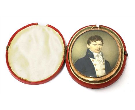 English School, circa 1810 PORTRAIT OF A YOUNG GENTLEMAN, BUST LENGTH, IN A BLUE COAT AND WHITE STOCK Miniature on ivory, ova