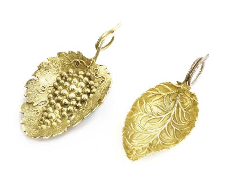 A silver gilt caddy spoon , by FW, Birmingham, date letter rubbed, the leaf moulded bowl with ring handle, together with a fu