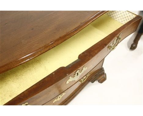 A serpentine mahogany commode chest, late 18th century, possibly American, of four graduated drawers, with fluted corners, on