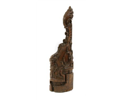 A profusely carved oak pew end , 19th century, now a stick stand , 140cm high