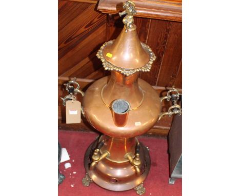A large circa 1900 copper and brass samovar, the cherub finial over bulbous form shape body with twin handles, height 96cm