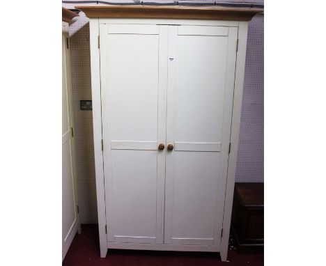 A contemporary white painted double door wardrobe, having light oak cavetto cornice, width 118.5cm