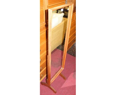 A 1970s teak cheval mirror by Reflectwell of Uxbridge (labelled verso), height 133cm, width 42.5cmCondition report: Frame wit