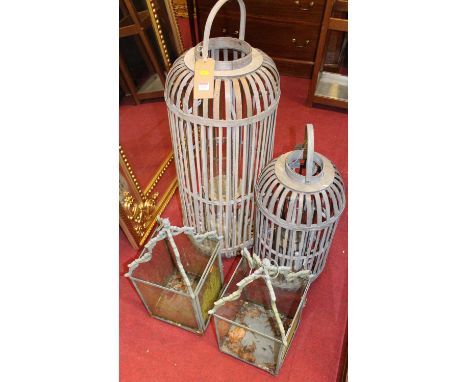 A pair of grey painted wrought iron hanging lanterns (one with single glazed side panel missing), each height 60cm, and two f