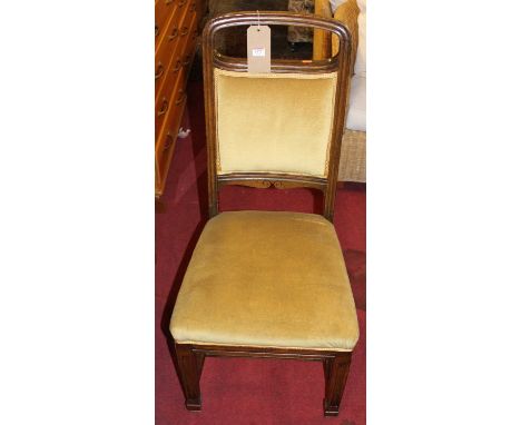 A set of six early 20th century Belgian oak dining chairs, having upholstered pad backs and stuff over seatsCondition report: