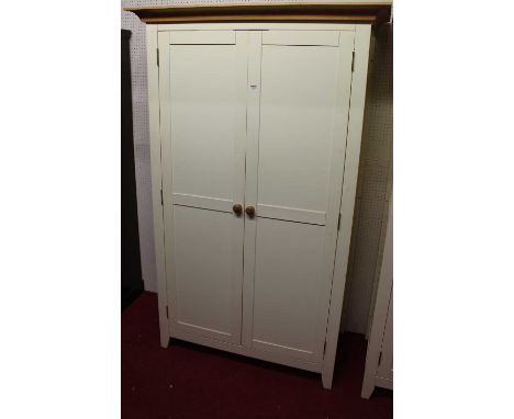 A contemporary white painted double door wardrobe, having light oak cavetto cornice, width 118.5cm