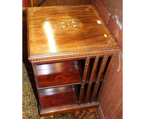 A good circa 1900 mahogany, satinwood and ivory inlaid revolving bookcase by Maple &amp; Co. having typical arrangement of ei