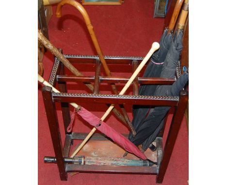 A mahogany six-division stick-stand and sundry contents, early 20th century 