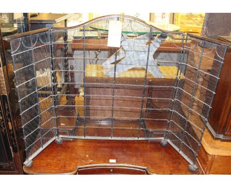 An early 20th century wrought iron and brass triptych fire screen, height 71cm