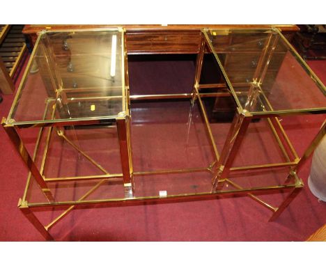 A 1980s polished brass framed and heavy glass topped rectangular low coffee table, length 130cm, together with a pair of matc