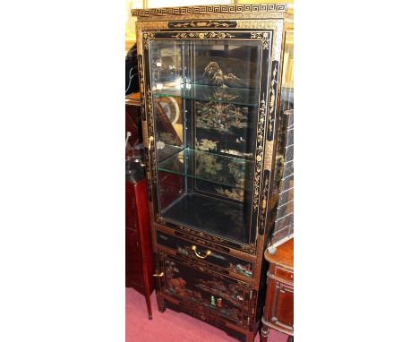 A contemporary Oriental black lacquered and gilt decorated display cabinet, having glazed door with adjustable glass shelves 