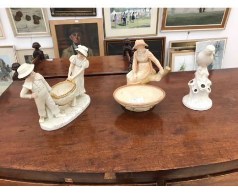 A Royal Worcester blush ivory figure of a lady sitting by a coracle, signed Hadley; together with a Royal Worcester bird figu