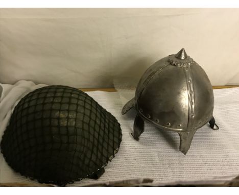 A post-war UK tin hat with liner; together with a tin helmet in English Civil War style