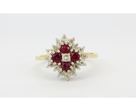 An 18ct yellow gold ruby and diamond set cluster ring, (N).