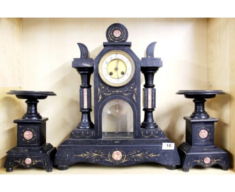 A large 19th Century French slate and marble mantle clock with garnitures, H. 48cm. (no pendulum or key).