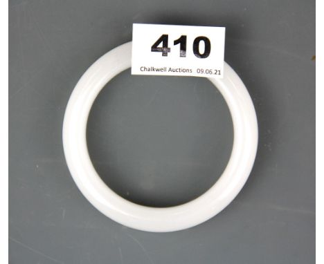 A Chinese white jade/hardstone bangle, internal Dia. 6.2cm.