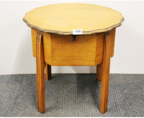 A 1930's light oak work box, Dia. 49cm. H. 48cm.