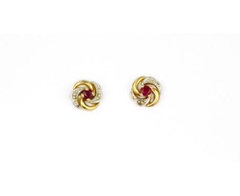 A pair of 9ct yellow gold ruby and diamond set stud earrings, Dia. 0.8cm, (with replaced butterflies).
