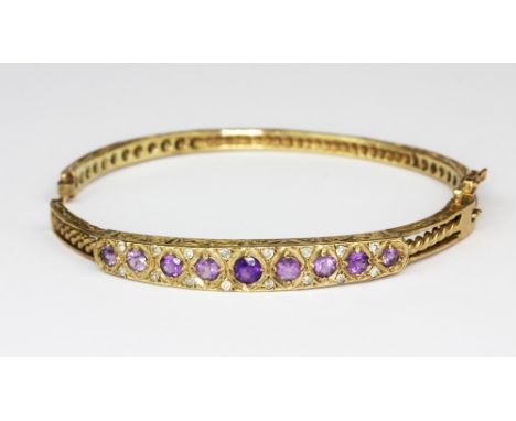 A yellow metal (tested 9ct gold) amethyst and diamond set bangle, a/f, approx. 13gr.