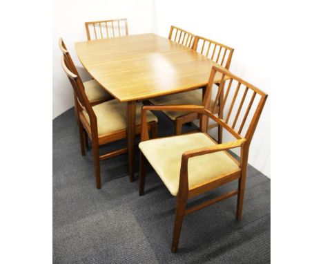 A 1960's light mahogany extending dining table and six chairs, table size 140 x 91cm.