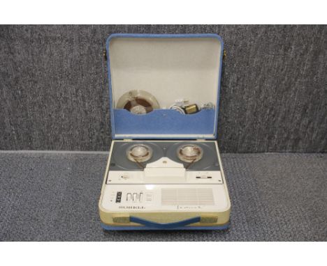 A vintage Sobell portable reel to reel tape recorder.