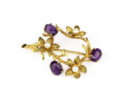 A 9ct gold floral spray brooch set with amethyst and pearls, L. 4.5cm. Maker mark C &amp; P.