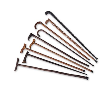 A GROUP OF NINE ASSORTED WALKING STICKS
All in various timbers, Sir Jeffrey Hillpig-Smyth shooting stick type, shell inset wi
