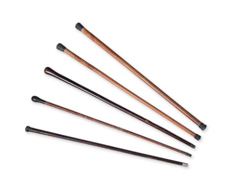 A GROUP OF FIVE WALKING CANES
Circa 19th/20th Century, includes two mounted with Chinese silver pommel in Malacca cane, an ex