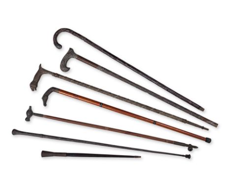 A GROUP OF SEVEN ASSORTED WALKING STICKS
Including Edwardian crook handled with sterling silver cap, hallmarked Chester 1904,