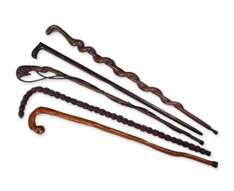 A GROUP OF FIVE ASSORTED WALKING STICKS
Includes Chinese rosewood example with inset silver and gold wire scene of figures in