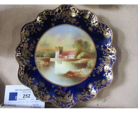 An Ansley cabinet plate, decorated with a view of a church by R J Keeling