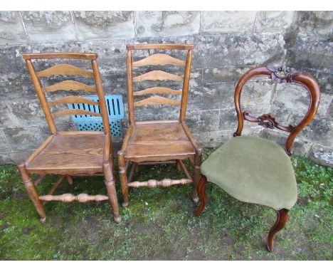 A pair of antique oak ladder back chairs together with a Victorian dining chair.&nbsp;