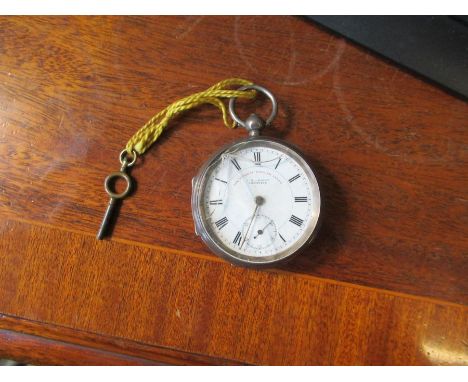 A silver cased open face pocket watch, with enamel dial, inscribed The Express English Lever, Graves Sheffield. key wind