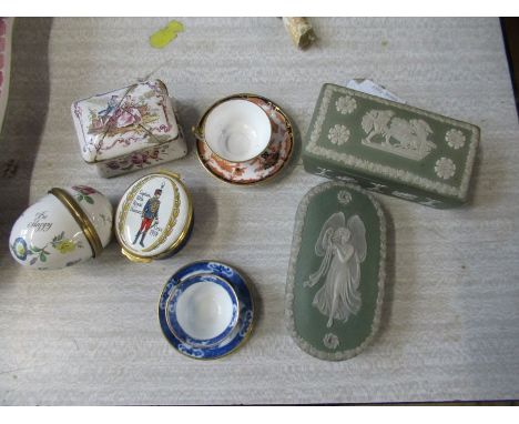 Two green jasper ware boxes, one marked Wedgwood, together with three enamel boxes and two miniature cups and saucers