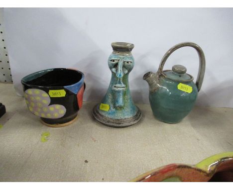 Three pieces of Studio pottery, to include a candlestick decorated with a face, marked Tom, Cornwall, a coffee pot and a mug