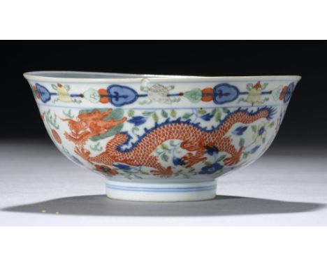 A CHINESE DOUCAI DRAGON AND PHOENIX BOWL, QING DYNASTY, DAOGUANG  SEAL MARK AND PERIOD the interior painted to the centre wit