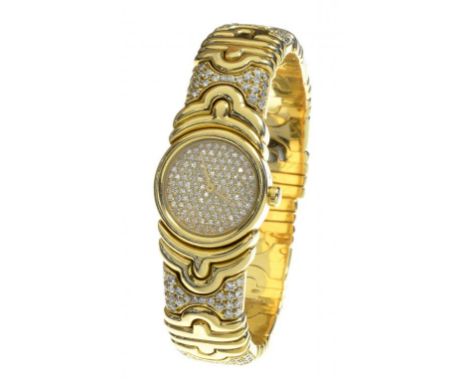 A BULGARI DIAMOND SET GOLD LADY'S WRISTWATCH  quartz movement with pavé set dial and   spring bangle, numbered inside back 37