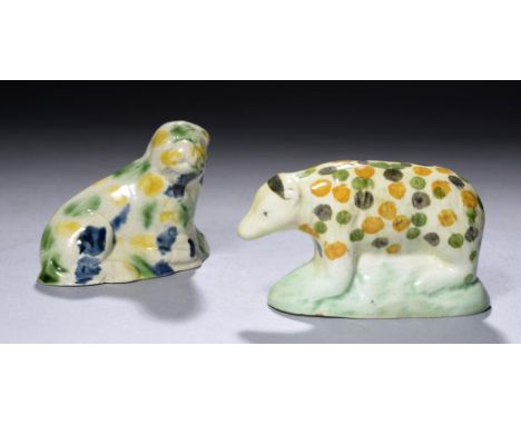 TWO CREAMWARE TOY ANIMALS, C1780-1800 one with underglaze blue and coloured glazes, the other with coloured oxide spots, on g
