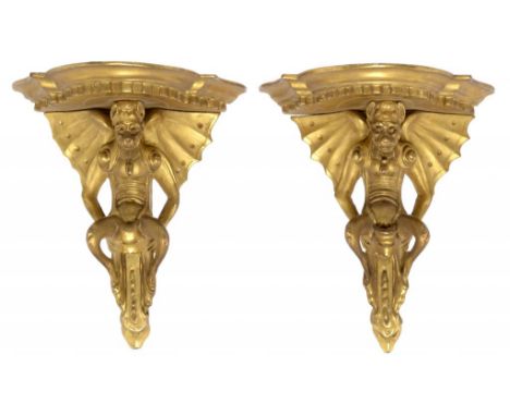 A PAIR OF ITALIAN GILTWOOD BRACKET SHELVES, FLORENCE, LATE 19TH C  the dentilated shelves supported by a winged demon, 19cm  