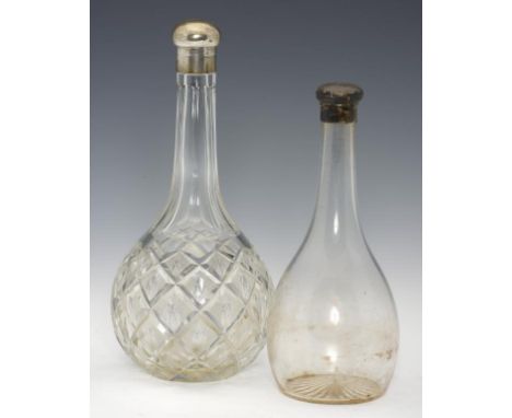 A SCOTTISH VICTORIAN SILVER MOUNTED GLASS BALUSTER DECANTER   with bun shaped cap and a larger silver  mounted cut glass deca