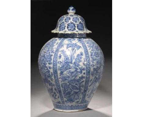 A NORTHERN EUROPEAN  FAIENCE JAR, EARLY 18TH C AND A  CHINESE BLUE AND WHITE PETAL LOBED COVER,  KANGXI the jar painted with 