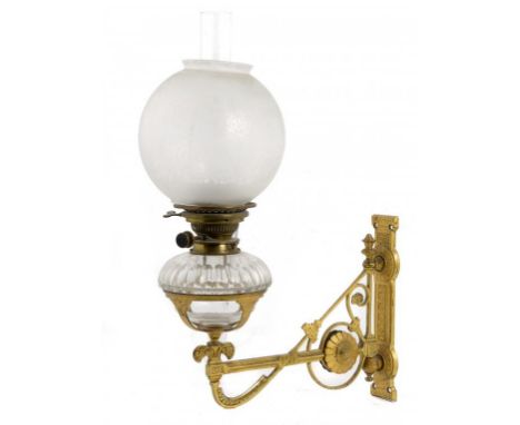 A VICTORIAN GILT BRASS PIVOTED LAMP BRACKET, THE DESIGN ATTRIBUTED TO BRUCE TALBERT, C1875  with a Victorian brass oil lamp b