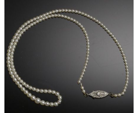 A NATURAL PEARL NECKLACE of 153 2.3-4.5mm approx natural (saltwater) pearls with diamond set shuttle shaped clasp, 5.6g and a