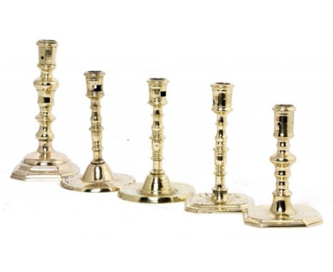 FIVE ENGLISH AND CONTINENTAL BRASS CANDLESTICKS, 18TH C  on round or octagonal foot, 15-21cm h++All wiht wear consistent with