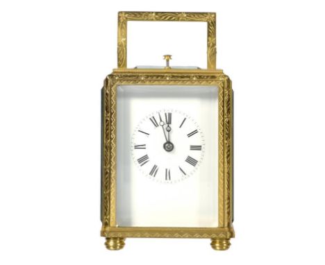 A FRENCH GILT BRASS 'ONE PIECE' CASED CARRIAGE CLOCK, LATE 19TH C  with enamel mask dial, the movement with the original plat